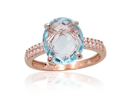 Red gold ring with zirconias and sky-blue topazes