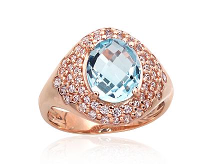 Ring aus Rotgold mit Zirkonia und himmelblauen Topasen