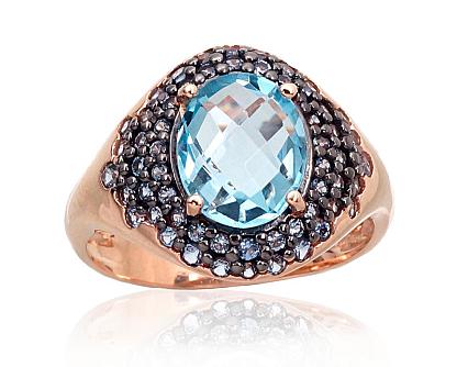 Ring aus Rotgold mit Zirkonia und himmelblauen Topasen